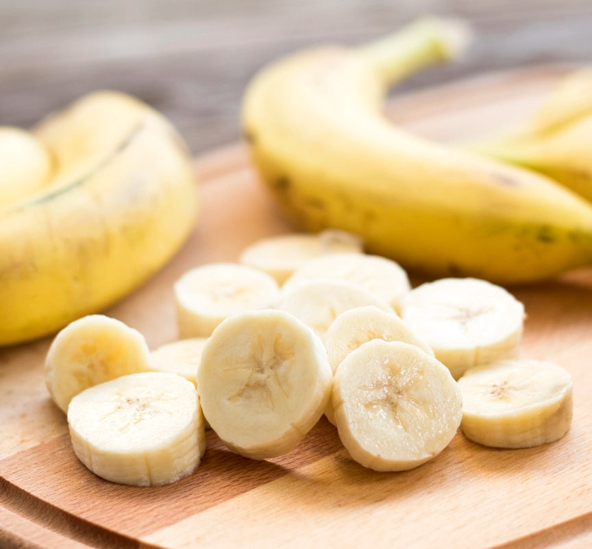 cut bananas on a shopping wooden board