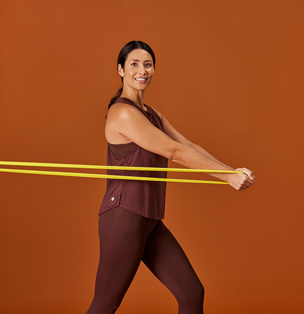 woman pulling resistance band