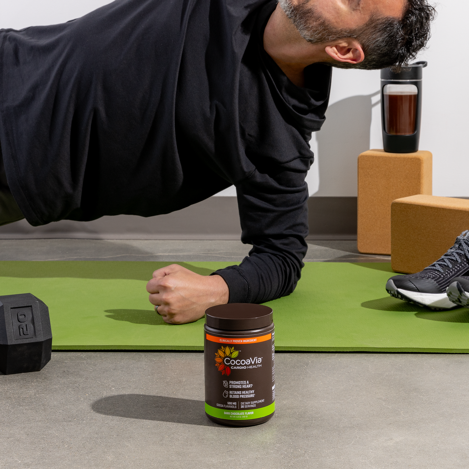 Cardio powder bottle and stretching in background