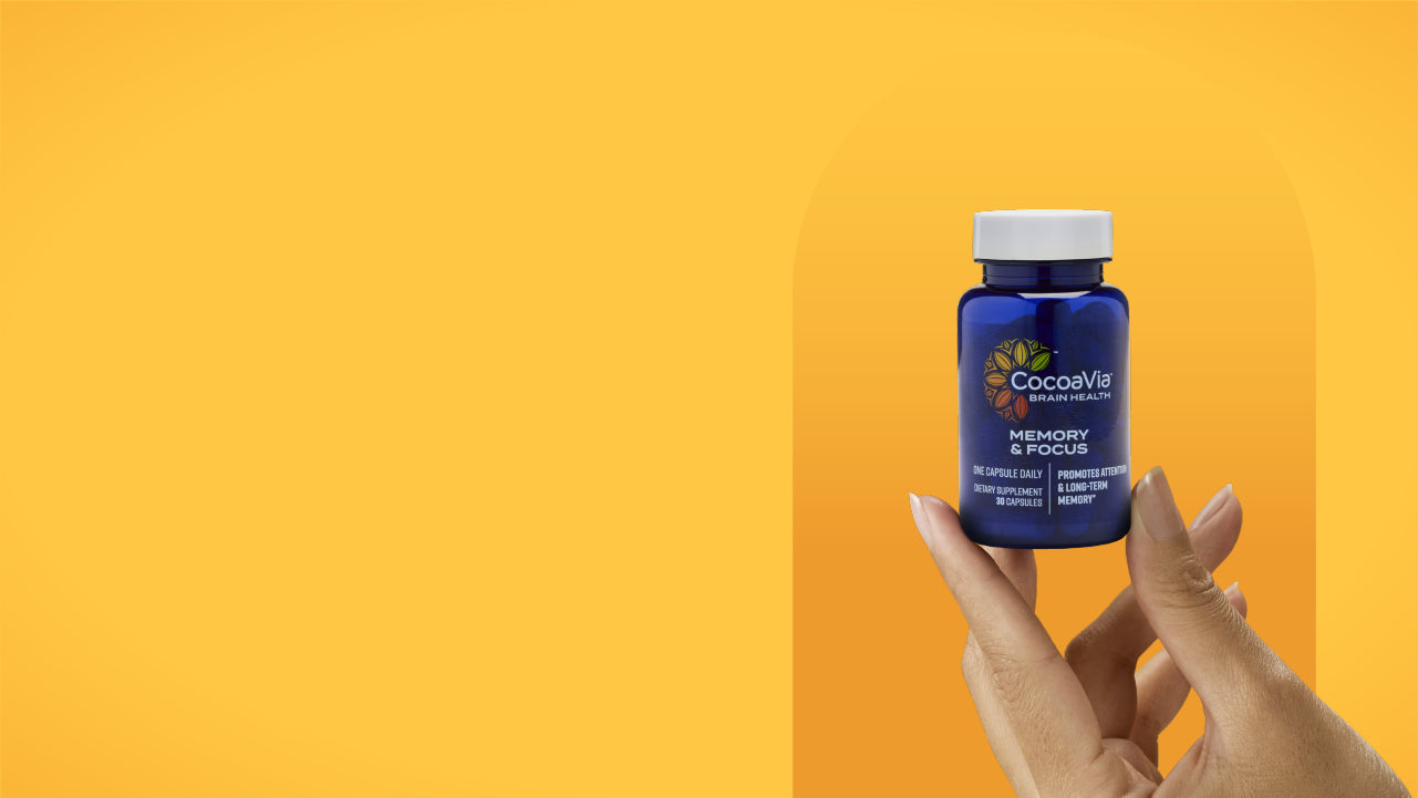 Cocoavia Memory & Focus Bottle held by a hand
