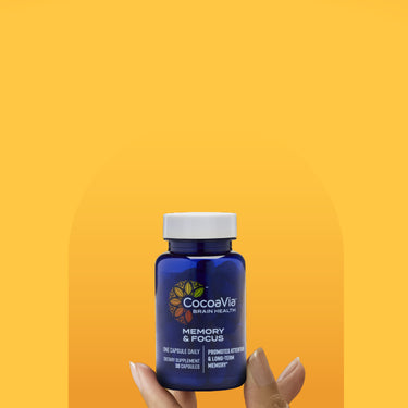 Cocoavia Memory & Focus Bottle held by a hand