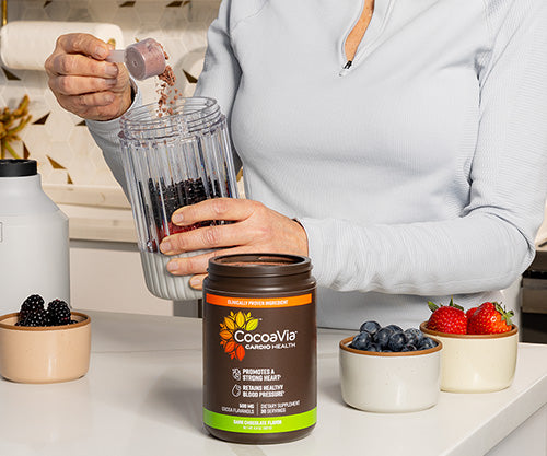 Woman making fruit smoothie