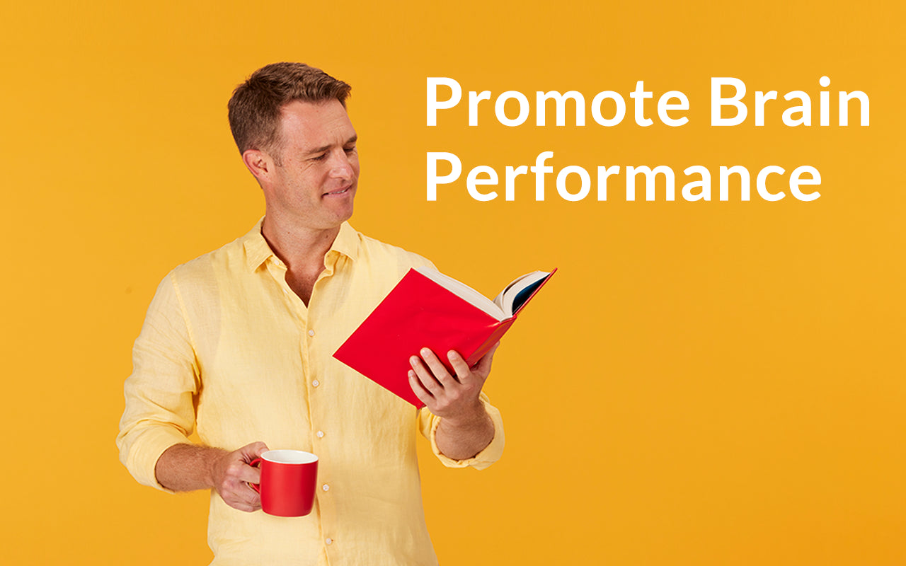 Man reading a book with a cup of coffee. Promote Brain Performance