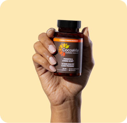 Cardio health capsule bottle in hand