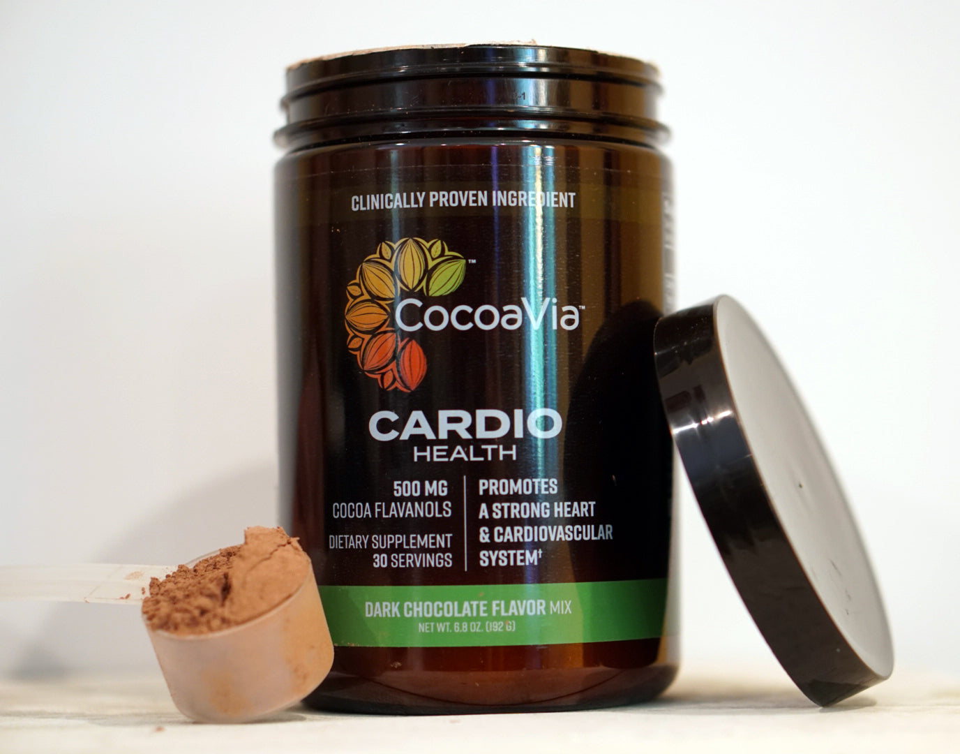 Cocoavia Cardio Health Powder Supplement with a scoop next to the tub