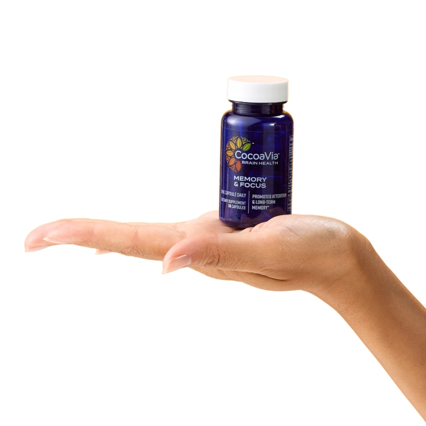 Hand holding CocoaVia Memory & Focus Bottle