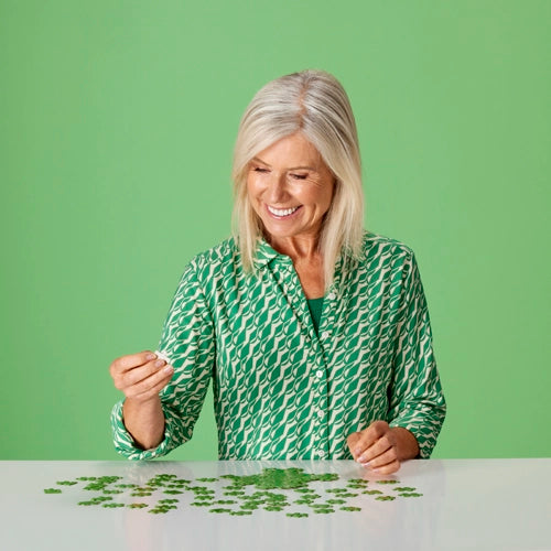 Elderly woman doing a puzzle