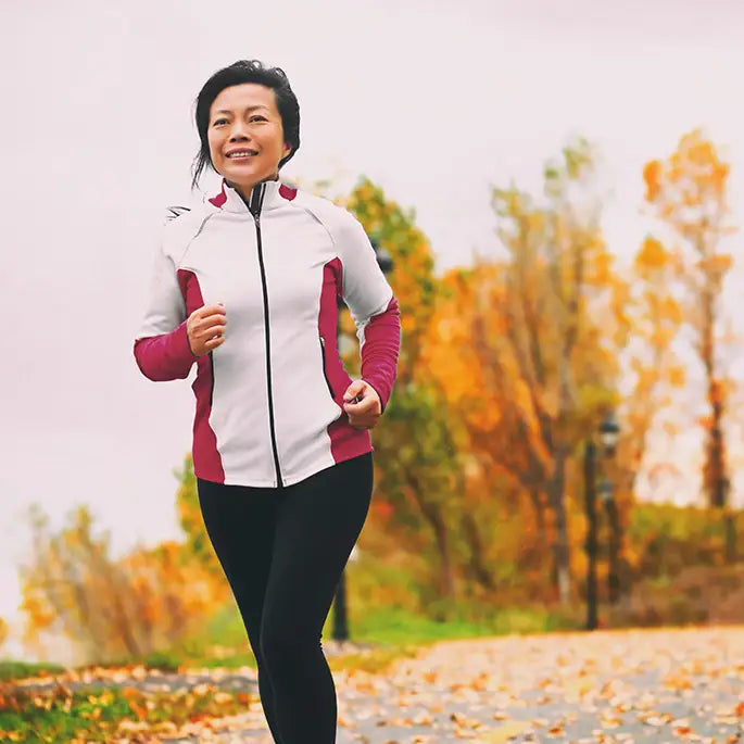 woman running outdoors in autumn