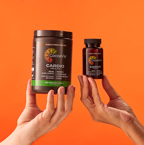Two hands holding Cardio Powder and Cardio capsules